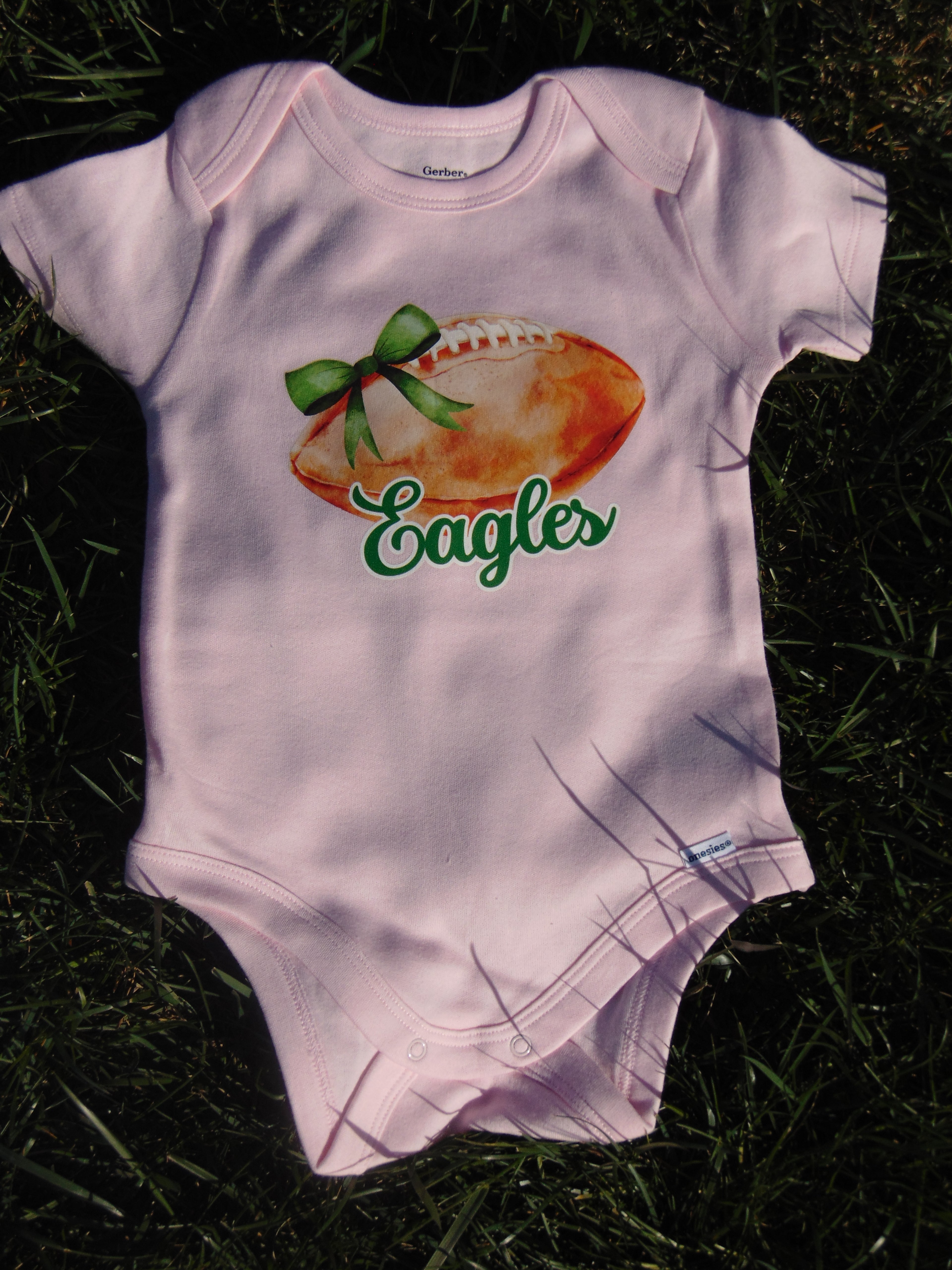 Pink Footballs + Bows Eagles Onesie