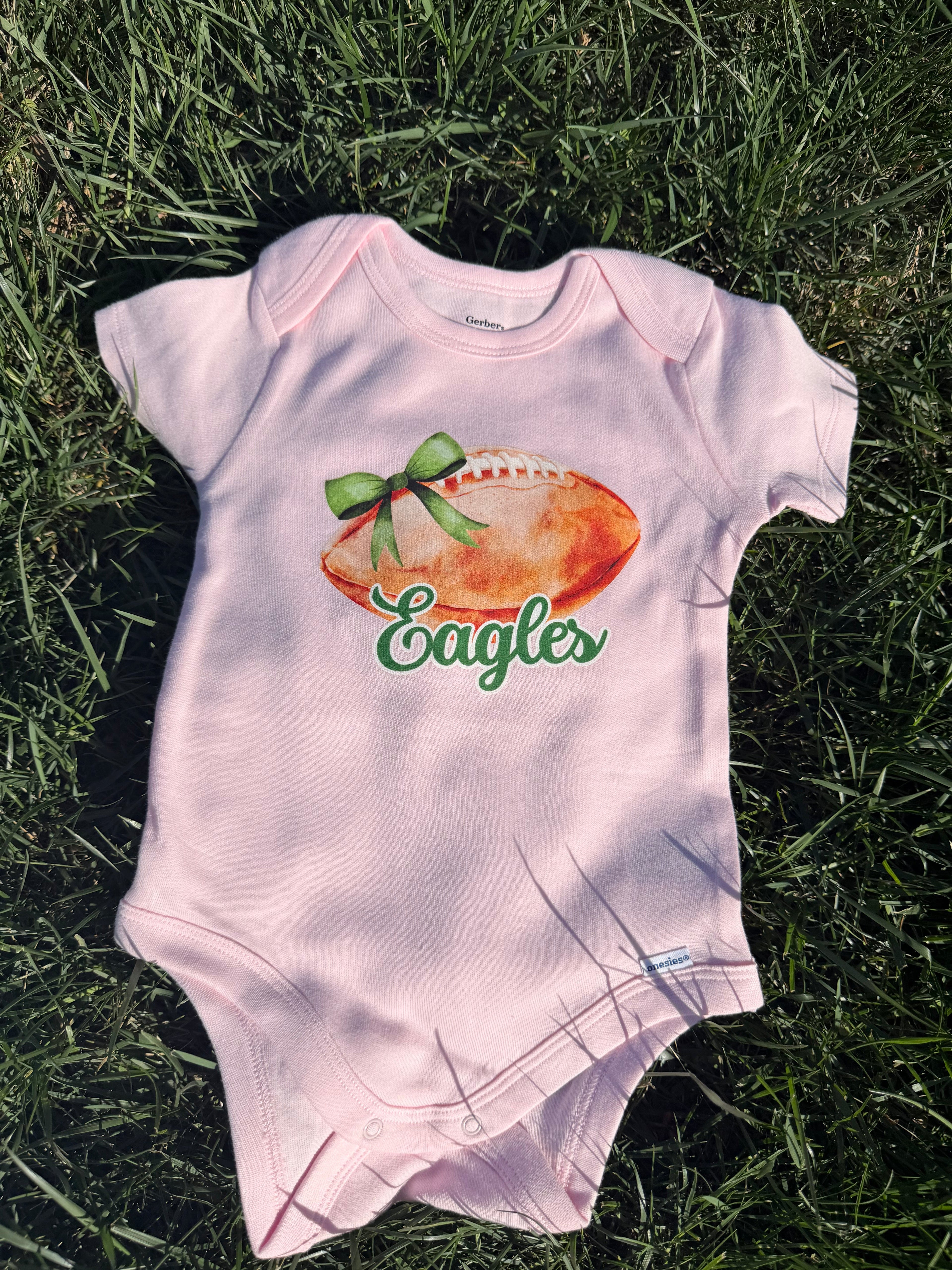 Pink Footballs + Bows Eagles Onesie